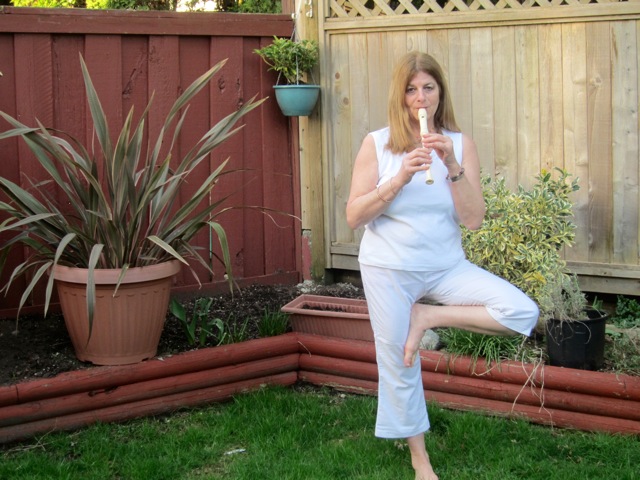 Playing the recorder in the yard