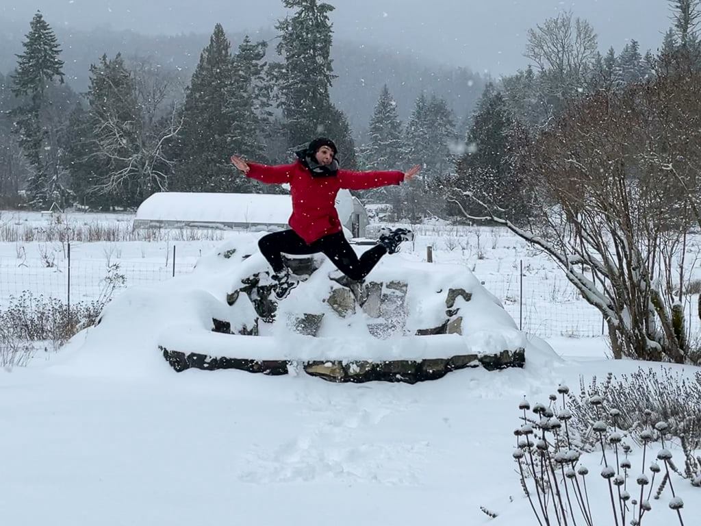 Marion in front of swan fountain in winter