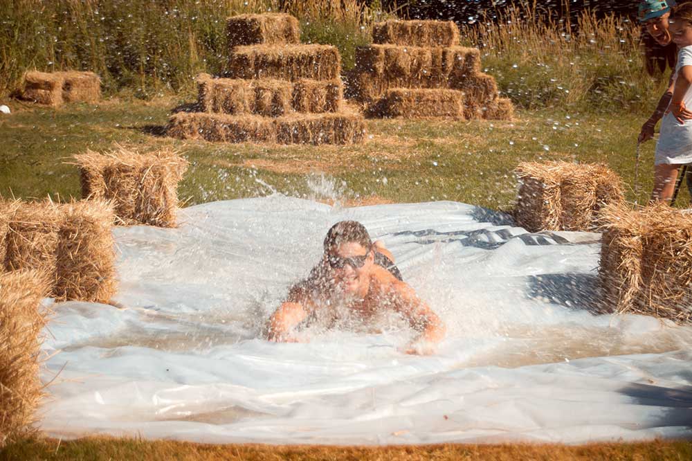 Annual Yoga Retreat - going down a slip and slide