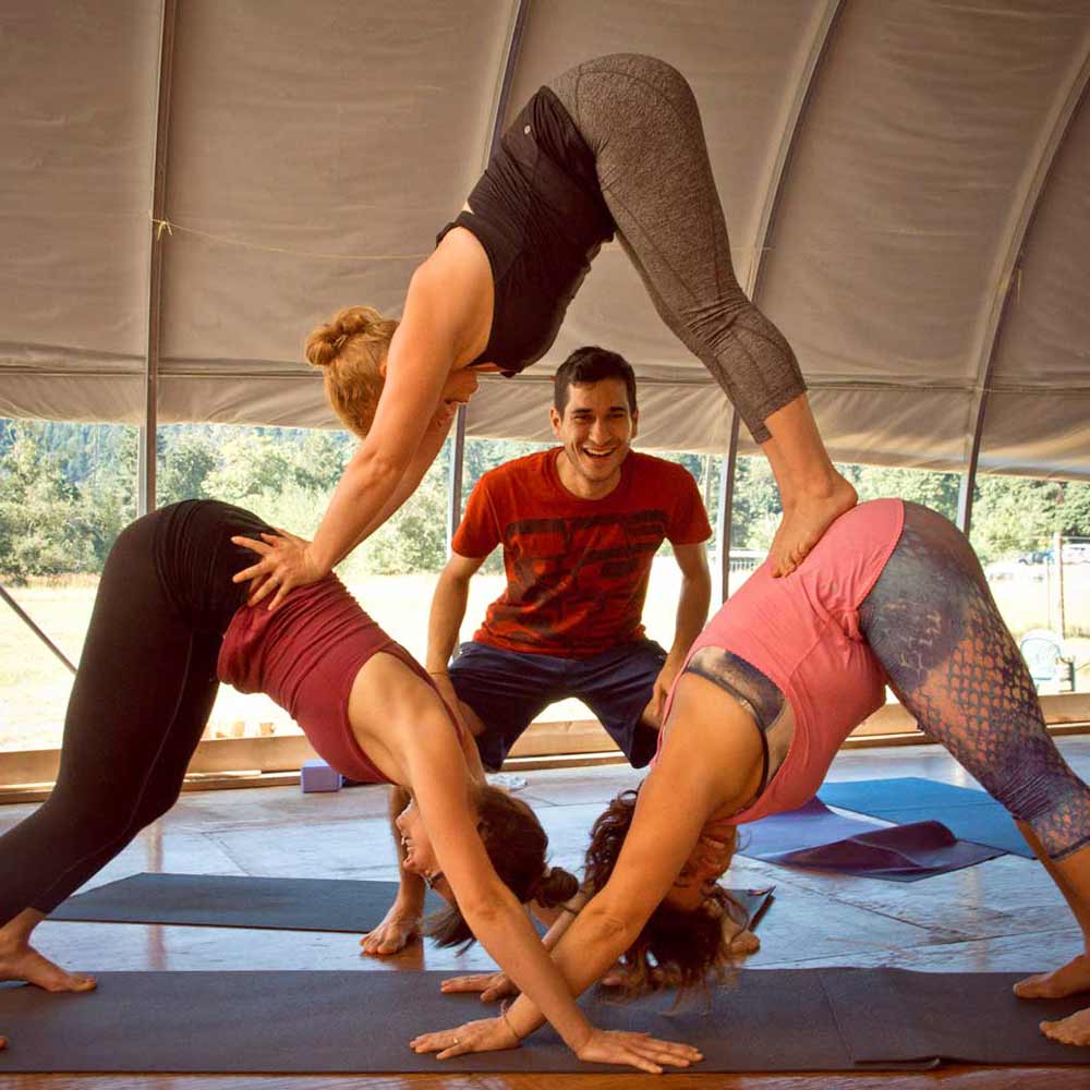 People at a yoga class making a pyramid