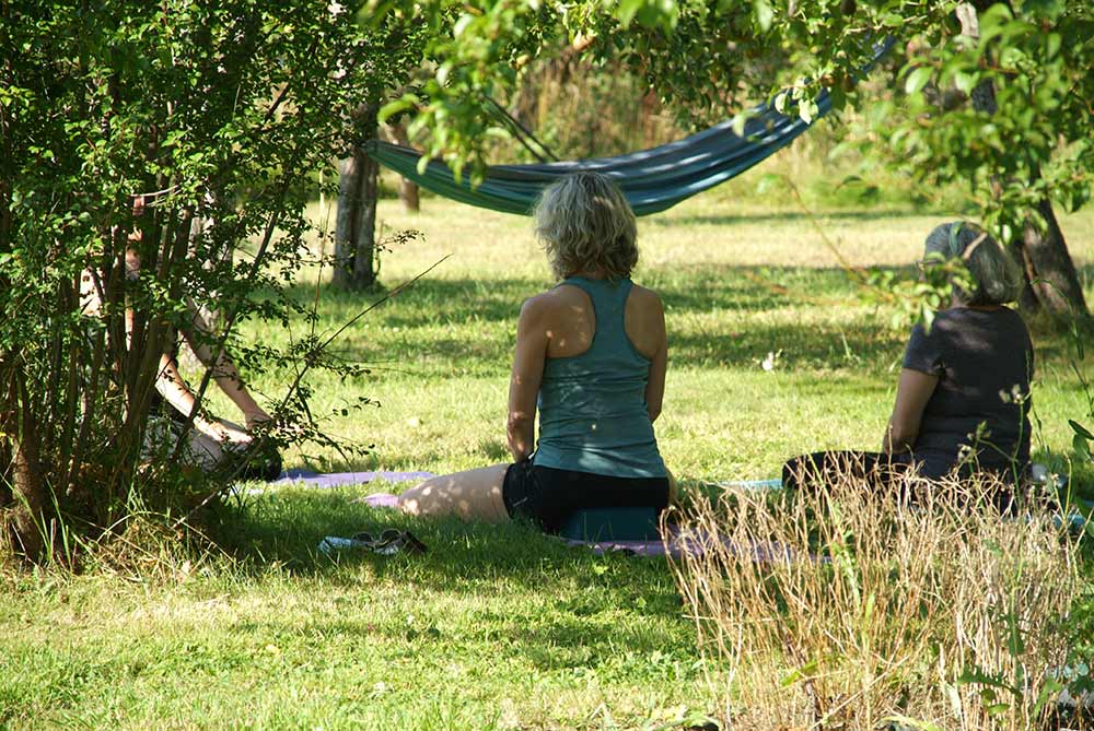 The serenity of yoga in the orchard at the Salt Spring Centre of Yoga