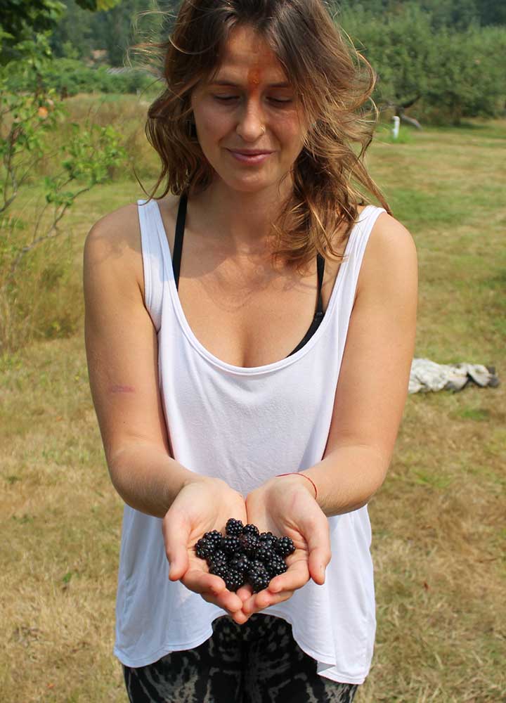 Woman-Holding-Blackberries