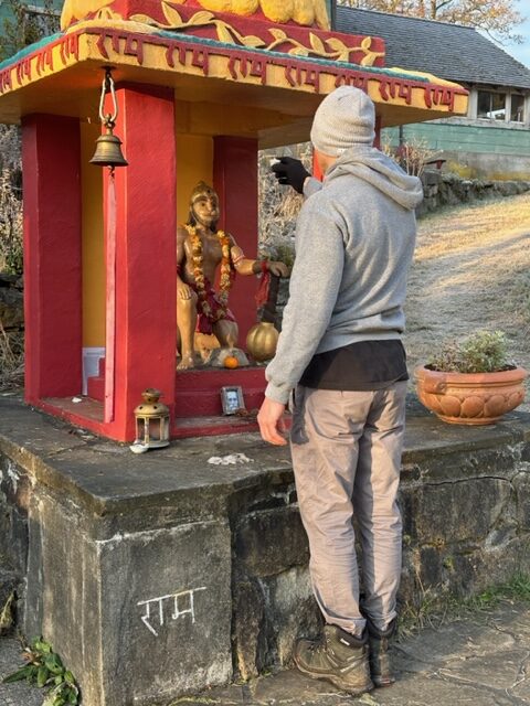 Joe lighting a deepam for Hanumanji