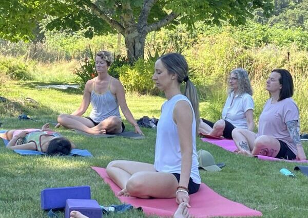 Alanna sitting in asana class