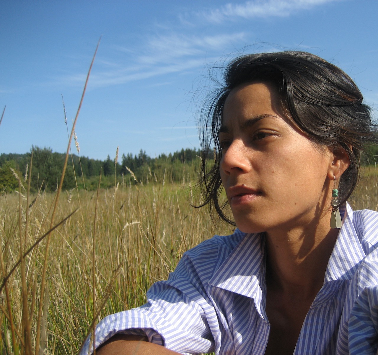 Keiko - profile photo sitting in field at the Centre